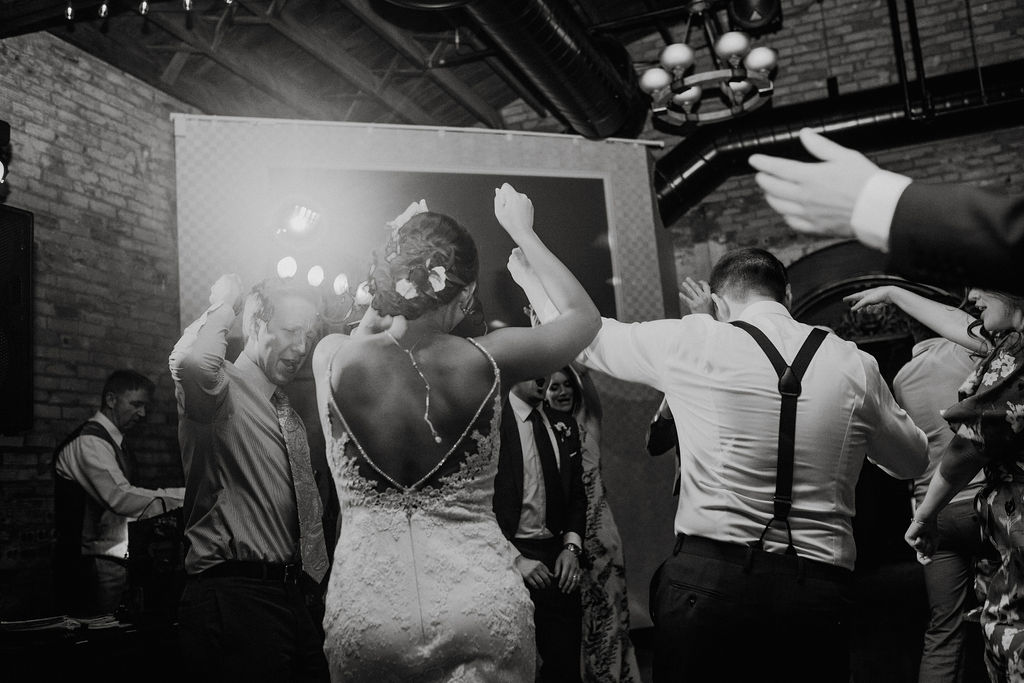 65 dancefloor fun energetic dance ceremony rachel desjardins studio wedding story telling moments photography kellermans event center minnesota emotional.jpg